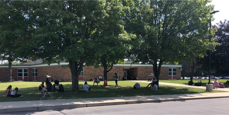 students outside in front of high school